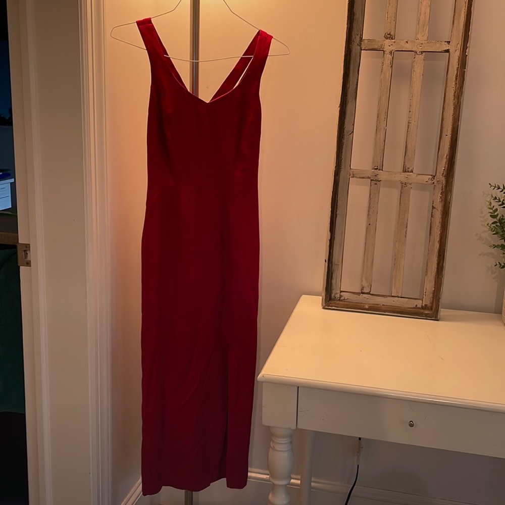 Red long party dress with crossover back.